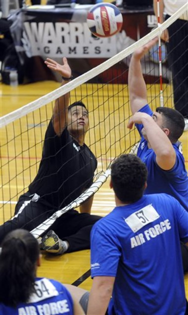 Air Force and Army play each other during sit down volleyball at the Olympic Training Center on Tuesday, May 11, 2010, in Colorado Springs, Colo. Air Force defeated Army and moved on the next round. (AP Photo/The Gazette, Bryan Oller) ** MAGS OUT; NO SALES **
